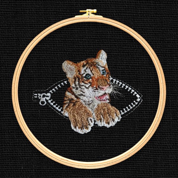 Tiger cub in a pocket with a zipper miniature realistic machine embroidery design