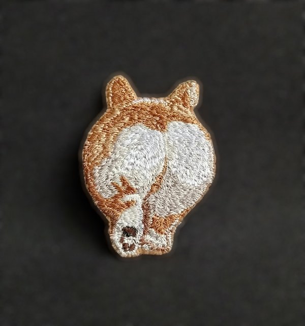 Miniature realistic design of a brooch, keychain, or patch «Corgi booty»