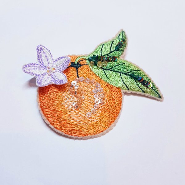 Mandarin Brooch on felt Machine embroidery design