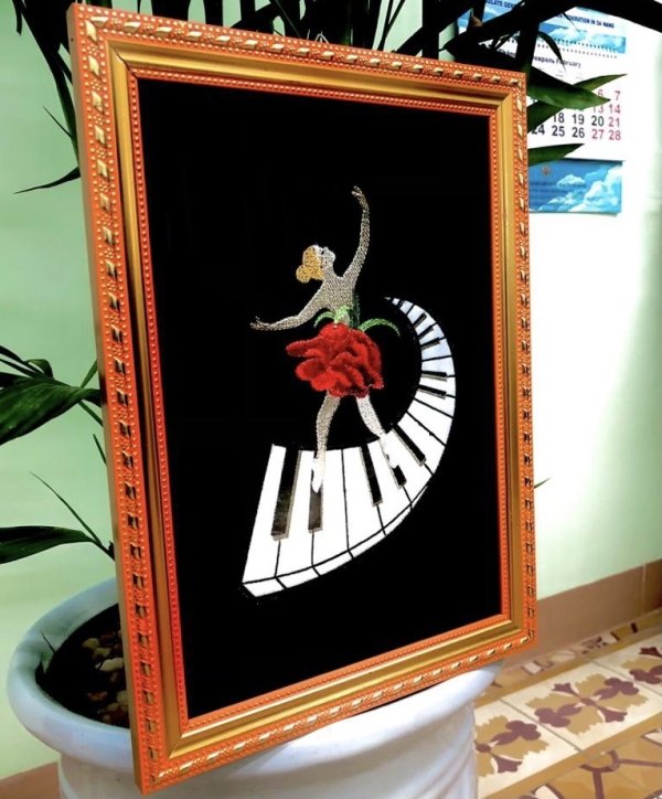 Ballerina on the piano Machine embroidery design with an applique element